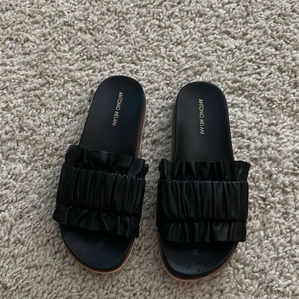 Antonio Melani slides